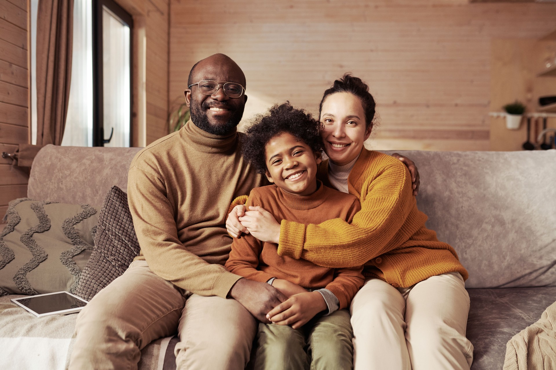Happy young parents and their cute son